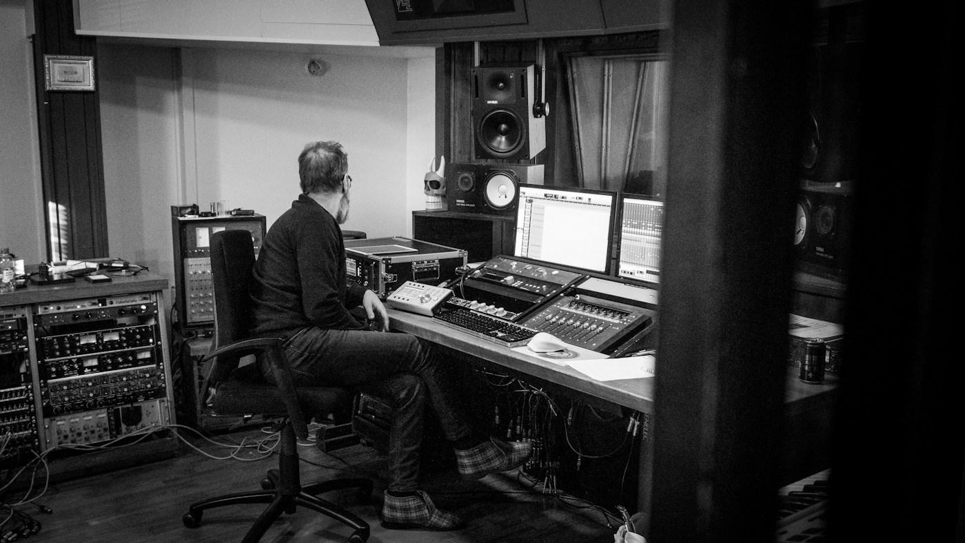 A music producer at work in a recording studio